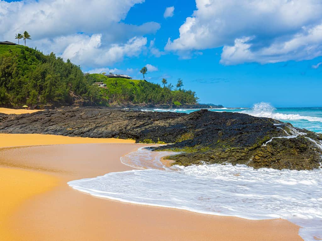 Waves Crash Over Exposed Lava Reef, Kauapea Beach, Kauai, Hawaii, USA