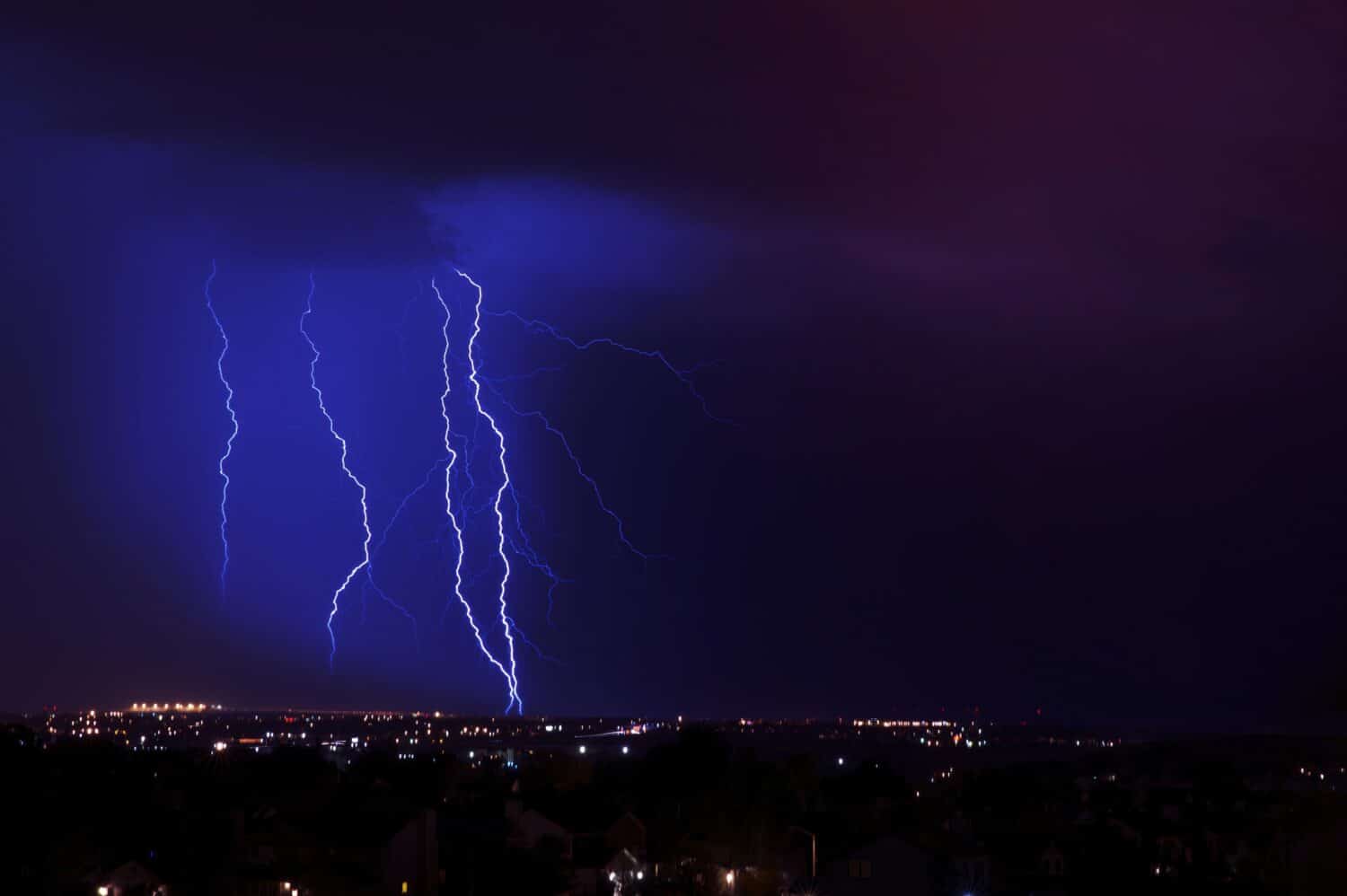 Overnight Lightning Storm. Storm Over City. Few Lightning Strikes. Stormy Overnight Weather in Colorado Springs Metro Area. Horizontal Photo.