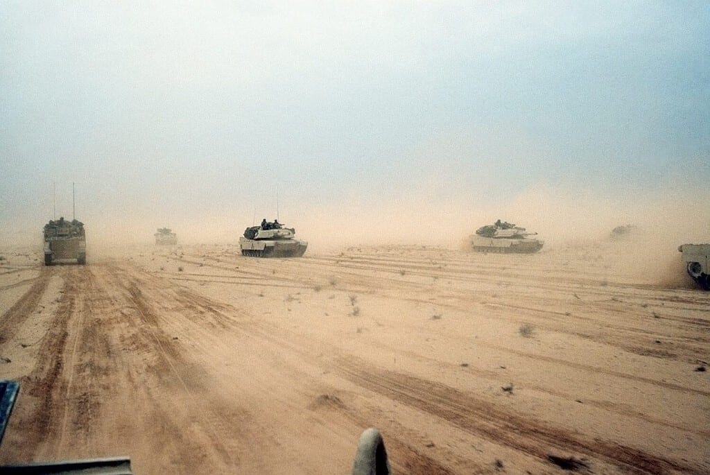 Abrams tanks of the 1st Armored Division 7th Corps move across the desert in northern Kuwait during Operation Desert Storm. Feb. 28 1991. Iraq, Persian Gulf War