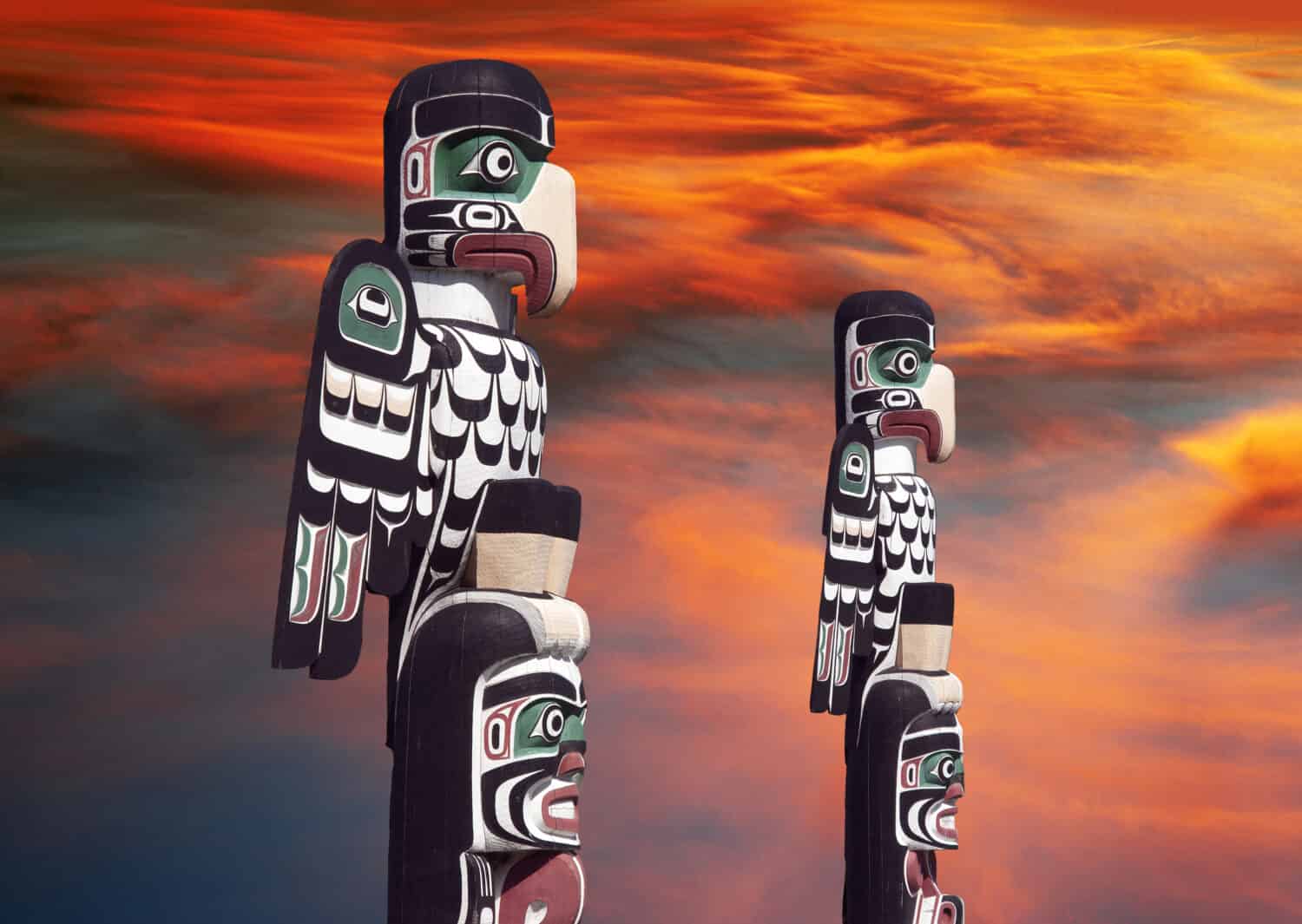 Totems with apocalyptic clouds in Courtenay, Vancouver Island, Canada