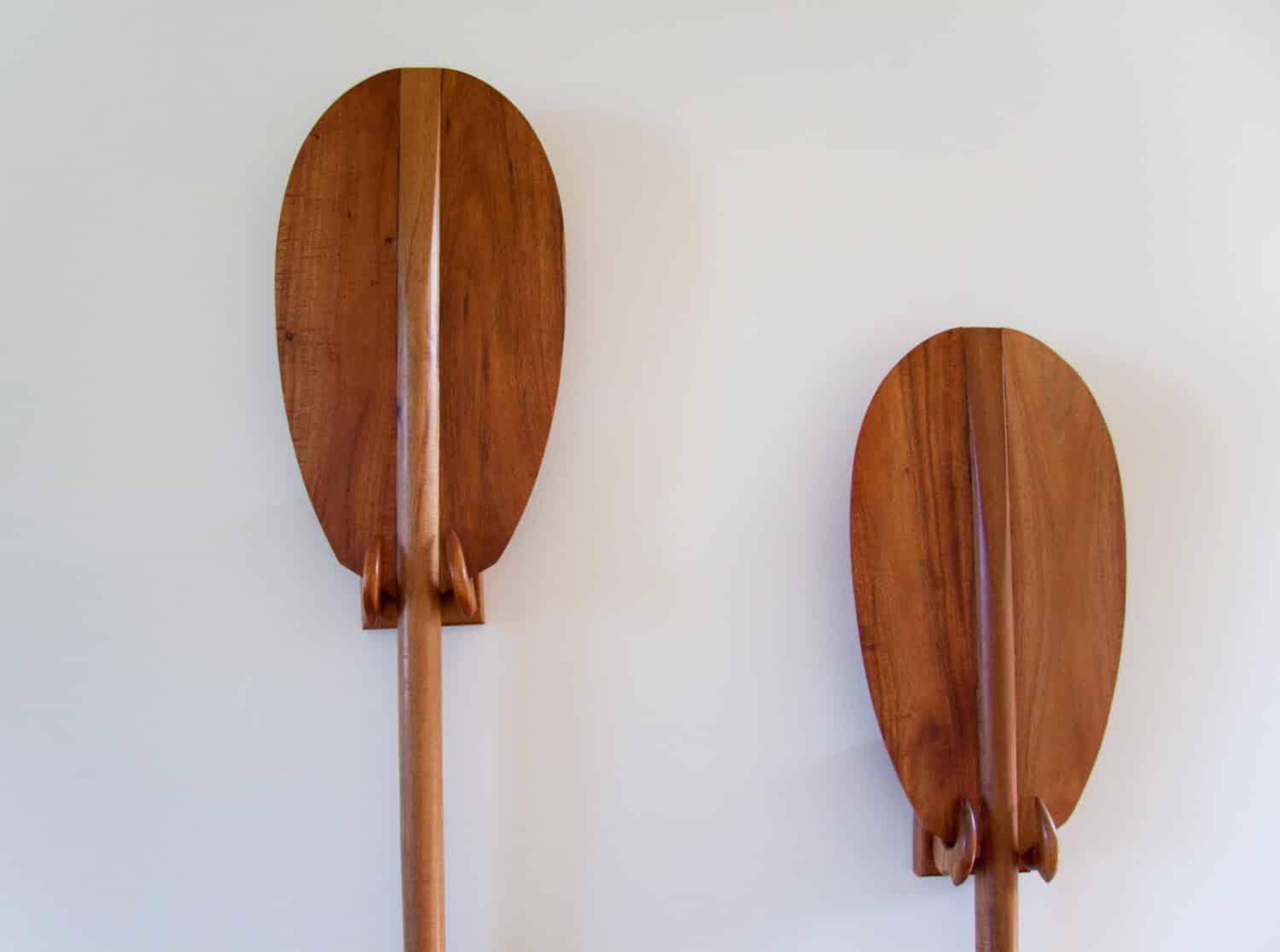 A pair of tradditional hawaiian paddles are used as a house decoration in oahu hawaii.