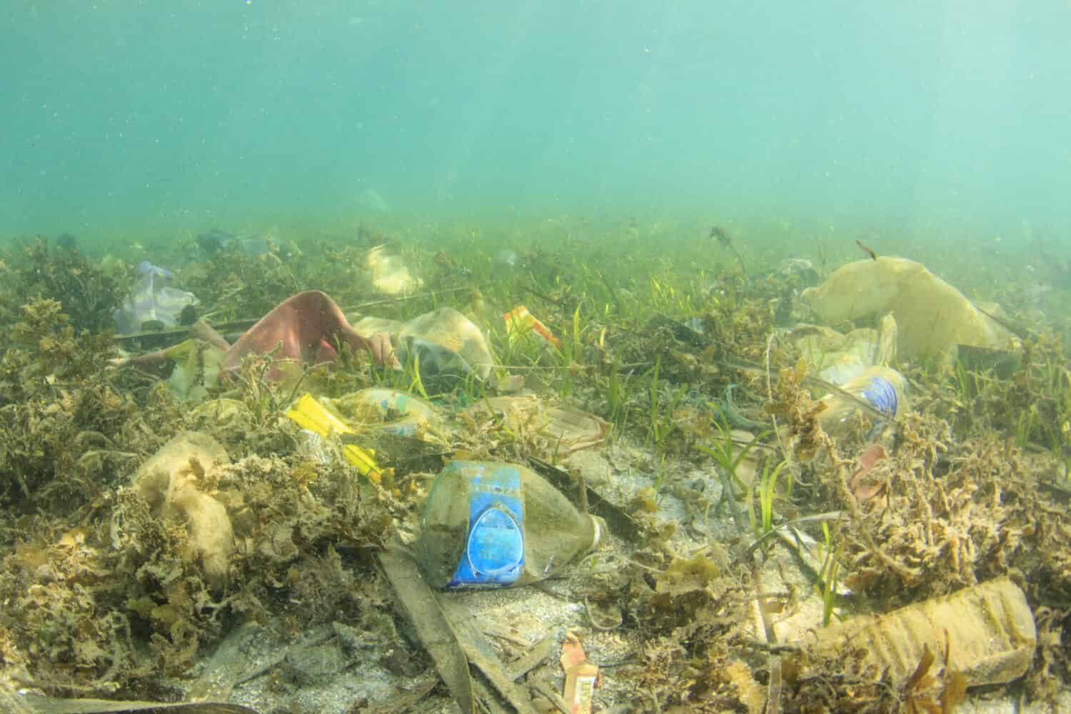 Plastic trash bags and bottles pollution in ocean