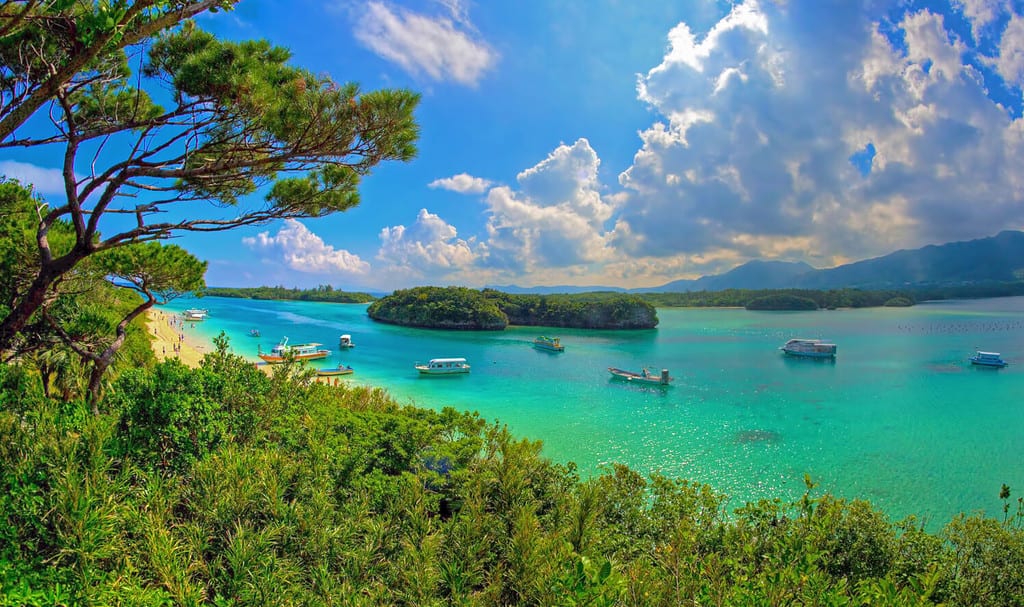 Kabira Bay scenery on Ishigaki island,okinawa prefecture,Japan.White sands, turquoise waters and dense vegetation,this bay is part of Iriomote Ishigaki National Park. Place of Scenic Beauty for the August weather of Japan.