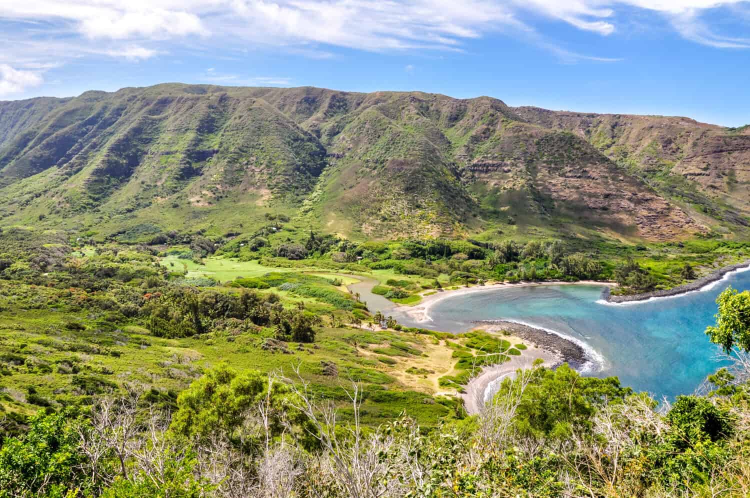 Beautiful view of Halawa Beach Park and the Halawa Valley on the remote island of Molokai (Moloka'i), Hawaii, USA.Two beaches, Kamaalaea and Kawili, are located in the bay. Popular tourist attraction.