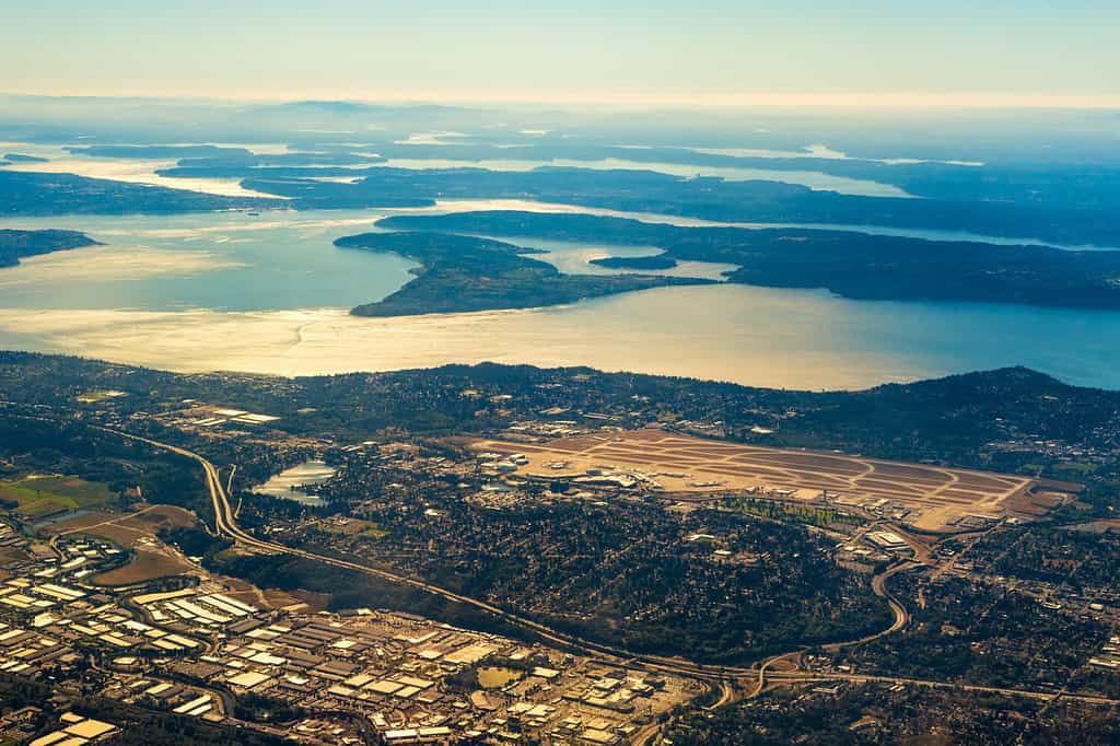 Seattle-Tacoma International Airport from the air with the southern end of Puget Sound in late afternoon light