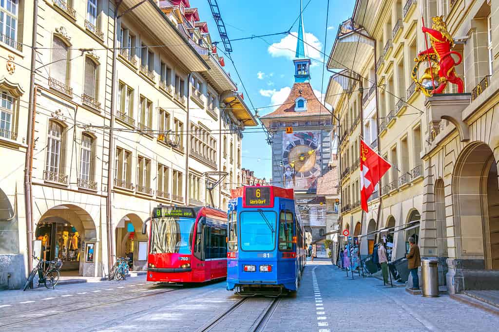 Streets with shopping area and Zytglogge astronomical clock tower in the historic old medieval city centre of Bern, Switzerland