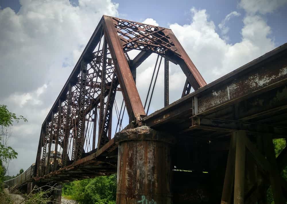 Photograph of Train on Railroad Bridge Over the Leaf River in Hattiesburg Mississippi on a Cloudy Day