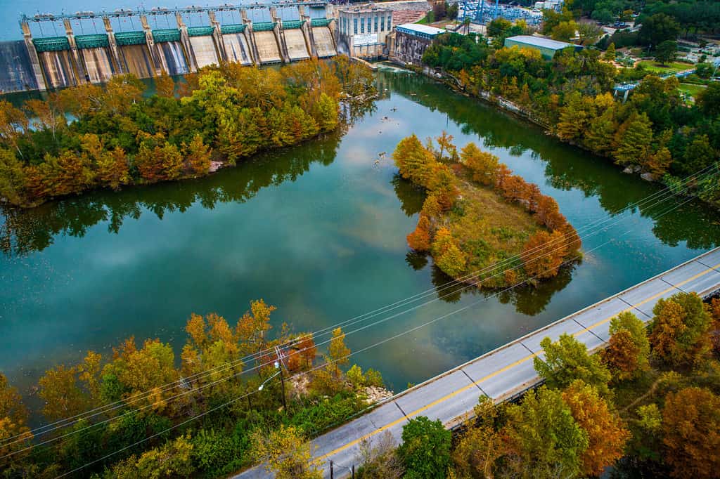 Fall Colors at tom miller dam aerial drone view above fall landscape at Red Bud Island in Austin, Texas