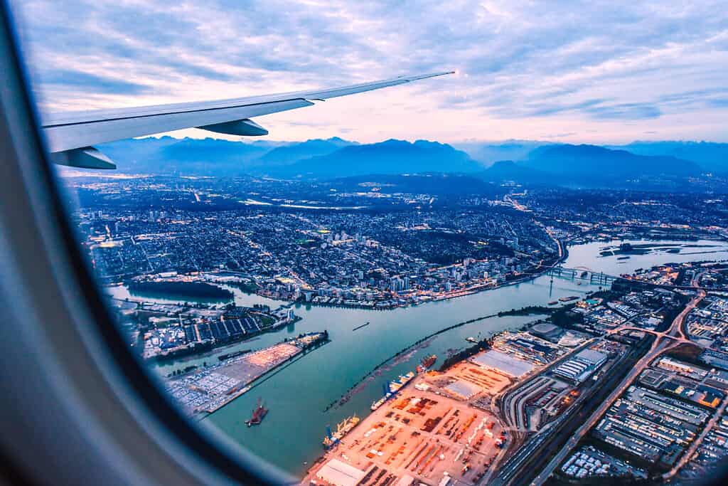 View from airplane window on fields in wing with top view of Vancouver, Canada. Vancouver International Airport, British Columbia.