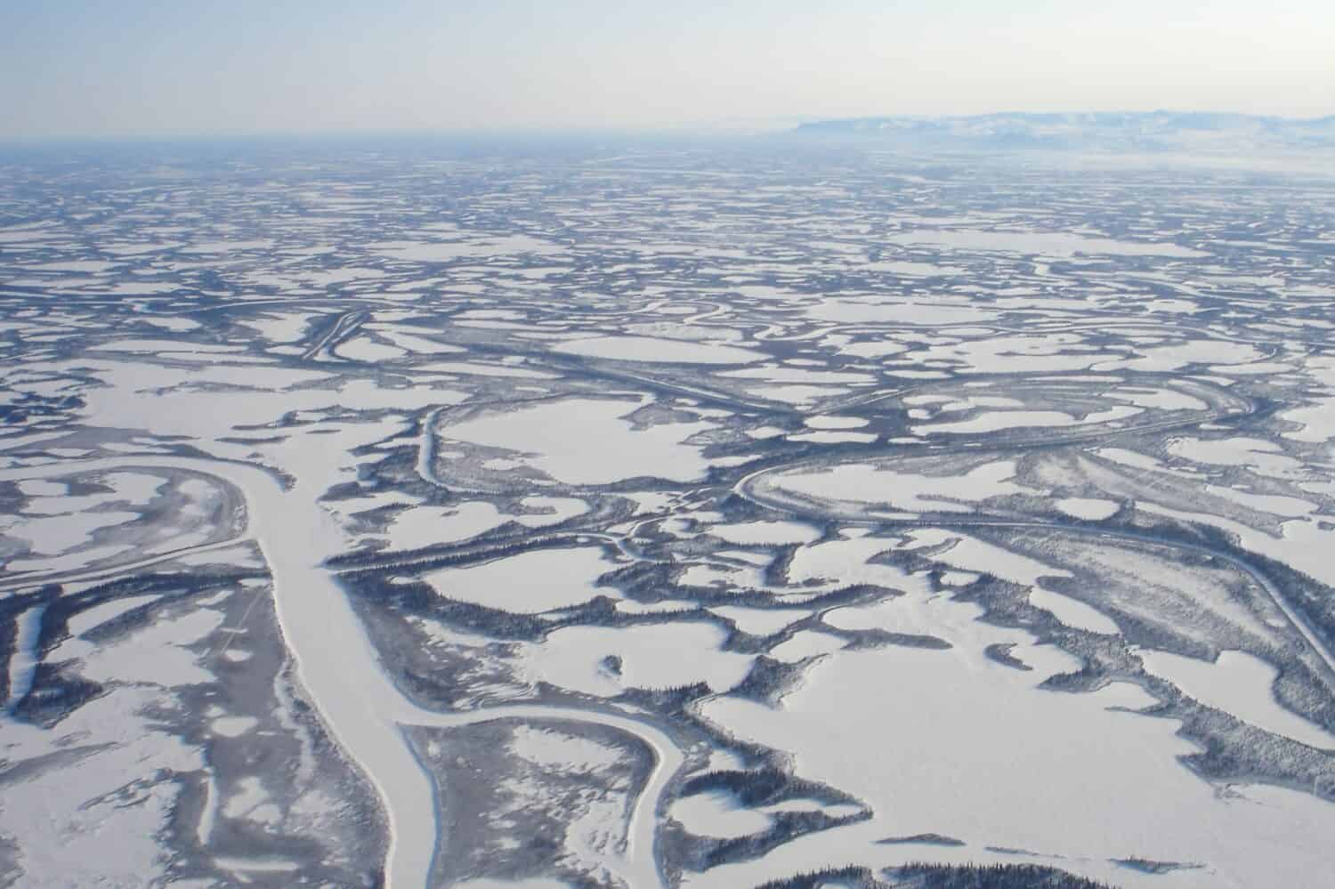 Aerial view of Canada's longest river, the Mackenzie River, empties into the Beaufort Sea, Arctic Ocean in a region known as the Mackenzie Delta. The Mackenzie Delta is the largest delta in Canada.
