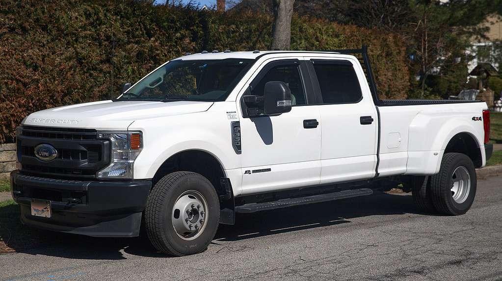 2022 Ford F350 Super Duty XL Crew Cab 4WD 6.7 PowerStroke Diesel with double rear wheels in White. Built at Ford's Kentucky Truck plant.