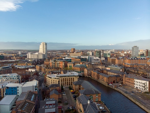 Aerial photo overlooking the Leeds City Center on a beautiful part cloudy day.