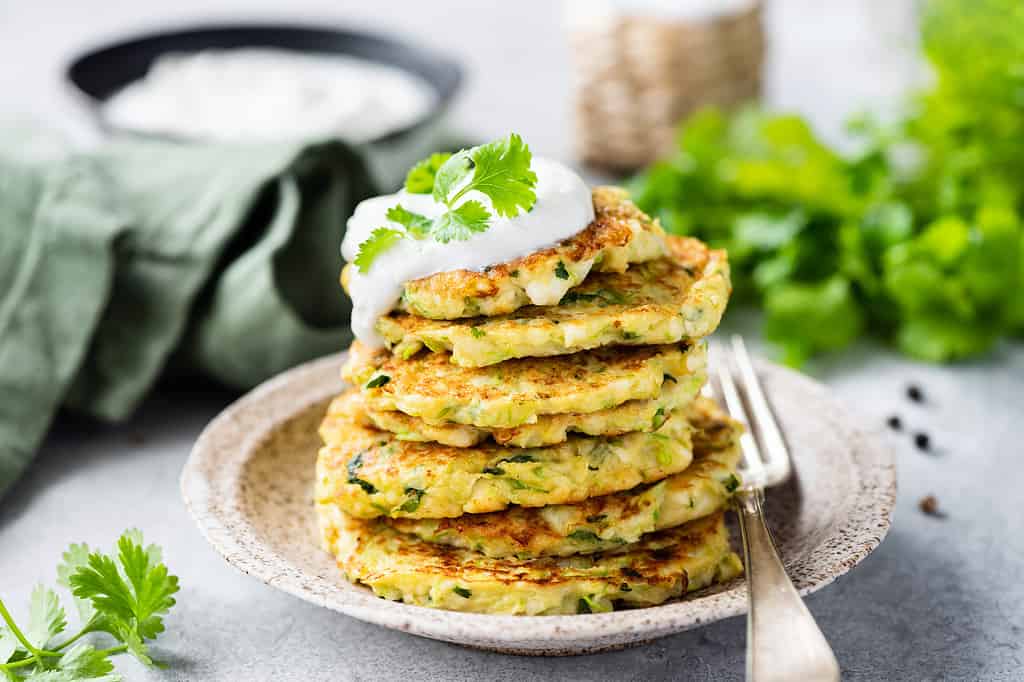 Vegetable zucchini fritters with sour cream