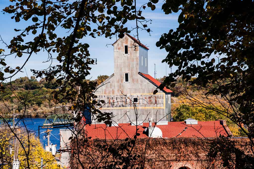 View of Stillwater Minnesota, of an old mill, framed by autumn leaves