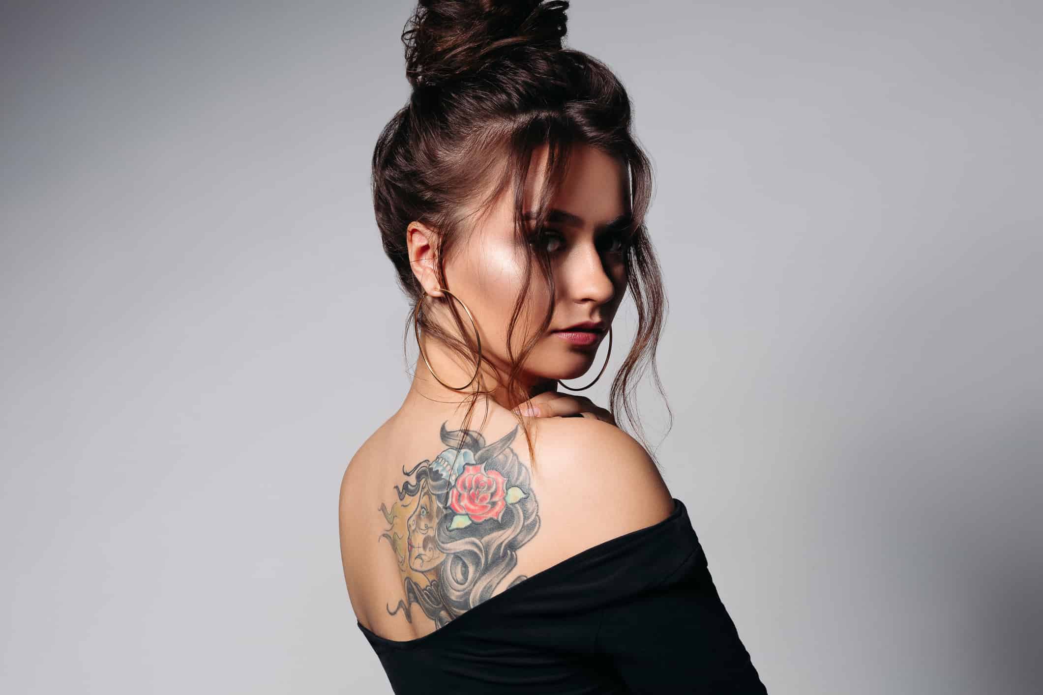 Fashionable Brunette Woman with Tattoo