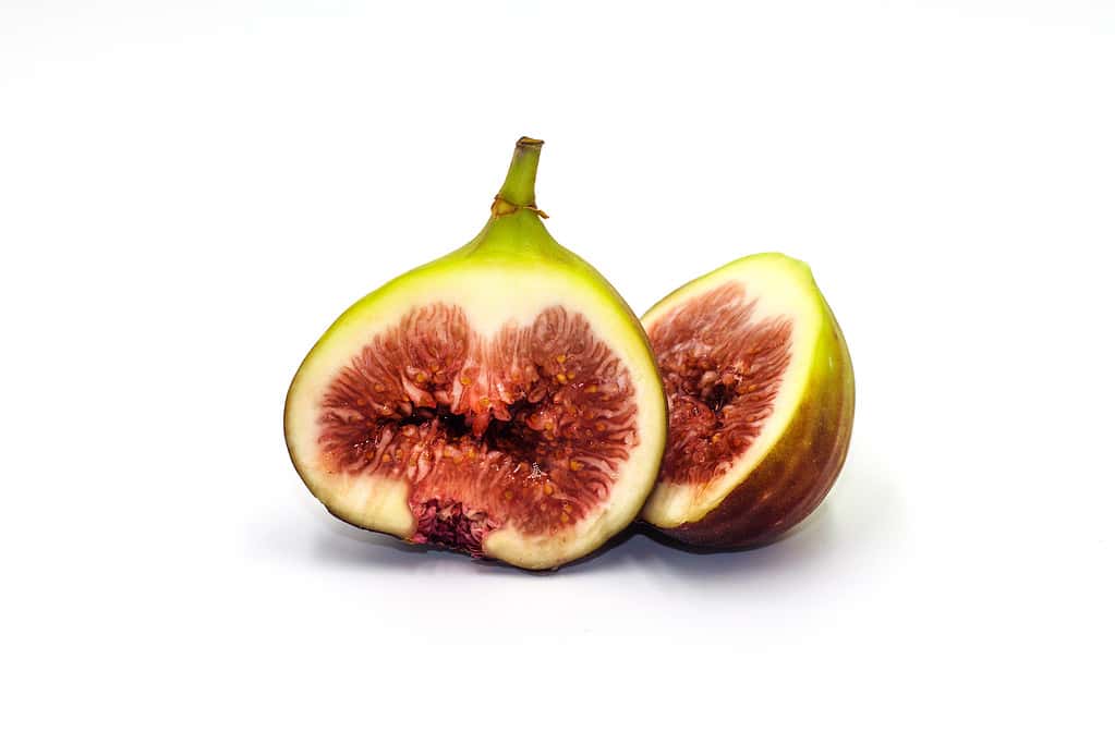 Fresh Brown turkey figs Half of fruit isolated on white background.
