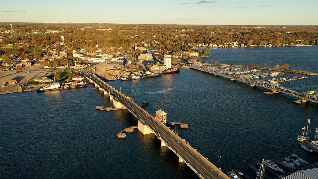 Establishing shot of Sturgeon Bay city in Door county, Wisconsin. Aerial view of American town. Sunny morning, sunrise. Spring summer season.