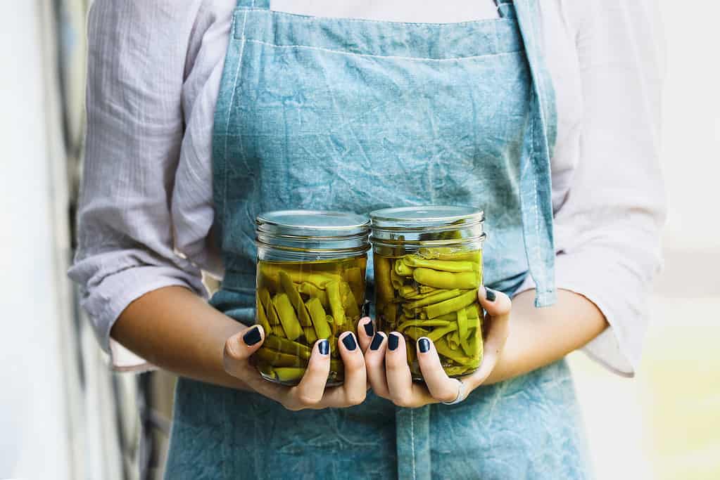 Woman Holding Fresh Canned Homemade Green Beans