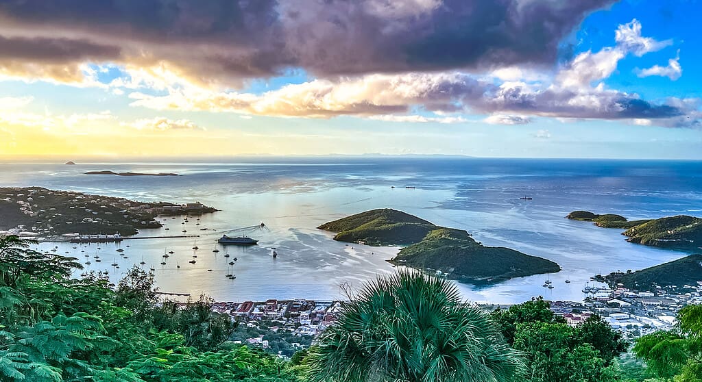 An image taken from the hilltop over  Charlotte Amalie on St. Thomas that shows vessels in the harbor and the mountains of St. Croix on the horizon.