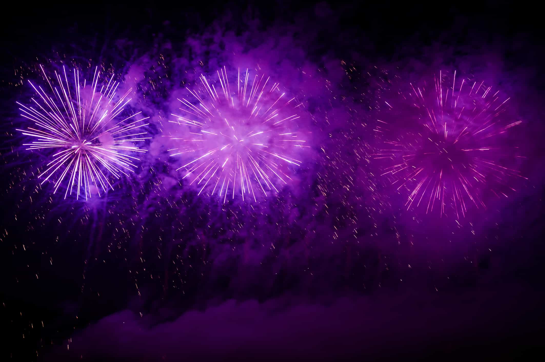 Purple fireworks on the night sky