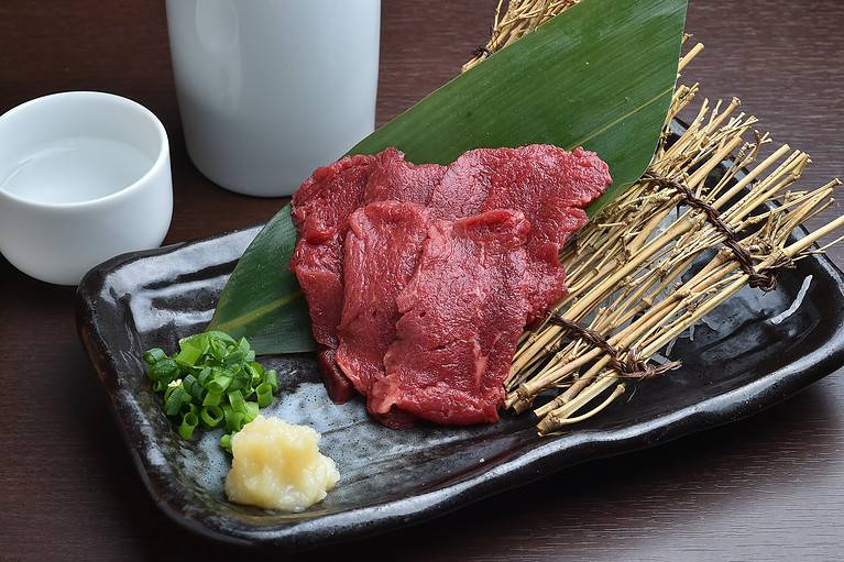Horse sashimi and sake