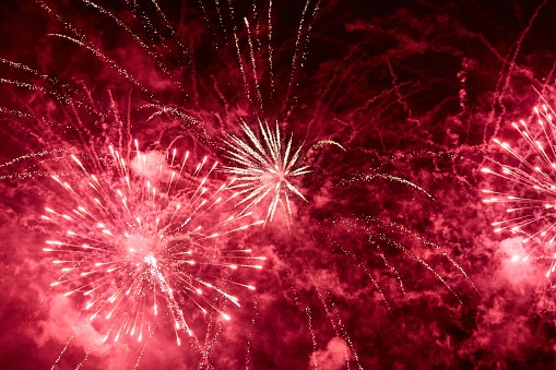 Red fireworks are usually created with strontium chloride or strontium nitrate.