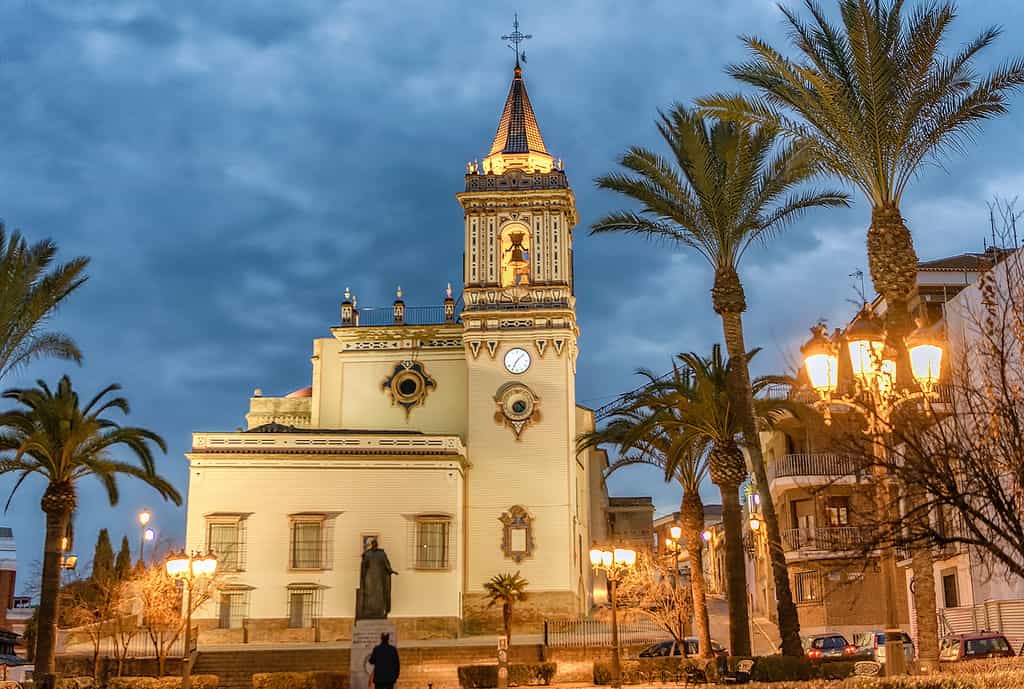 Beautiful San Pedro church and square in the city of Huelva at dusk.