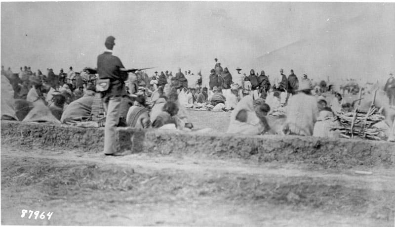 Navajos under guard at Fort Sumner, ca. 1864.
