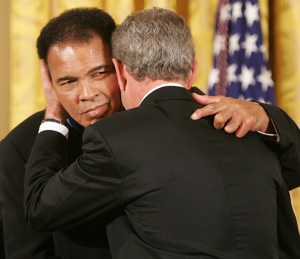 Muhammad Ali and wife, Lonnie. President George W. Bush introduces the 2005 recipients of the Presidential Medal of Freedom, Wednesday, Nov. 9, 2005 in the East Room of the White House.   Photo by Paul Morse, Courtesy of the George W. Bush Presidential Library