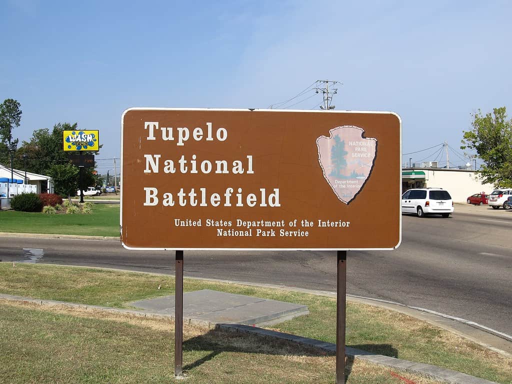 Tupelo National Battlefield, in Tupelo, Mississippi, commemorates the July 14–15, 1864, Battle of Tupelo in which Lieutenant General Nathan Bedford Forrest tried to cut the railroad supplying the Union's march on Atlanta. Established as Tupelo National Battlefield Site February 21, 1929; transferred from the War Department August 10, 1933; redesignated and boundary changed August 10, 1961. Listed on the National Register of Historic Places on October 15, 1966. Administered by the Natchez Trace Parkway.