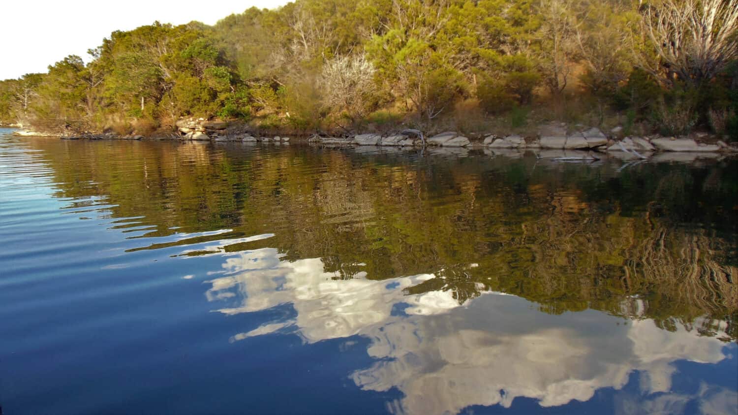 Evening reflection of sky on possum kingdom lake