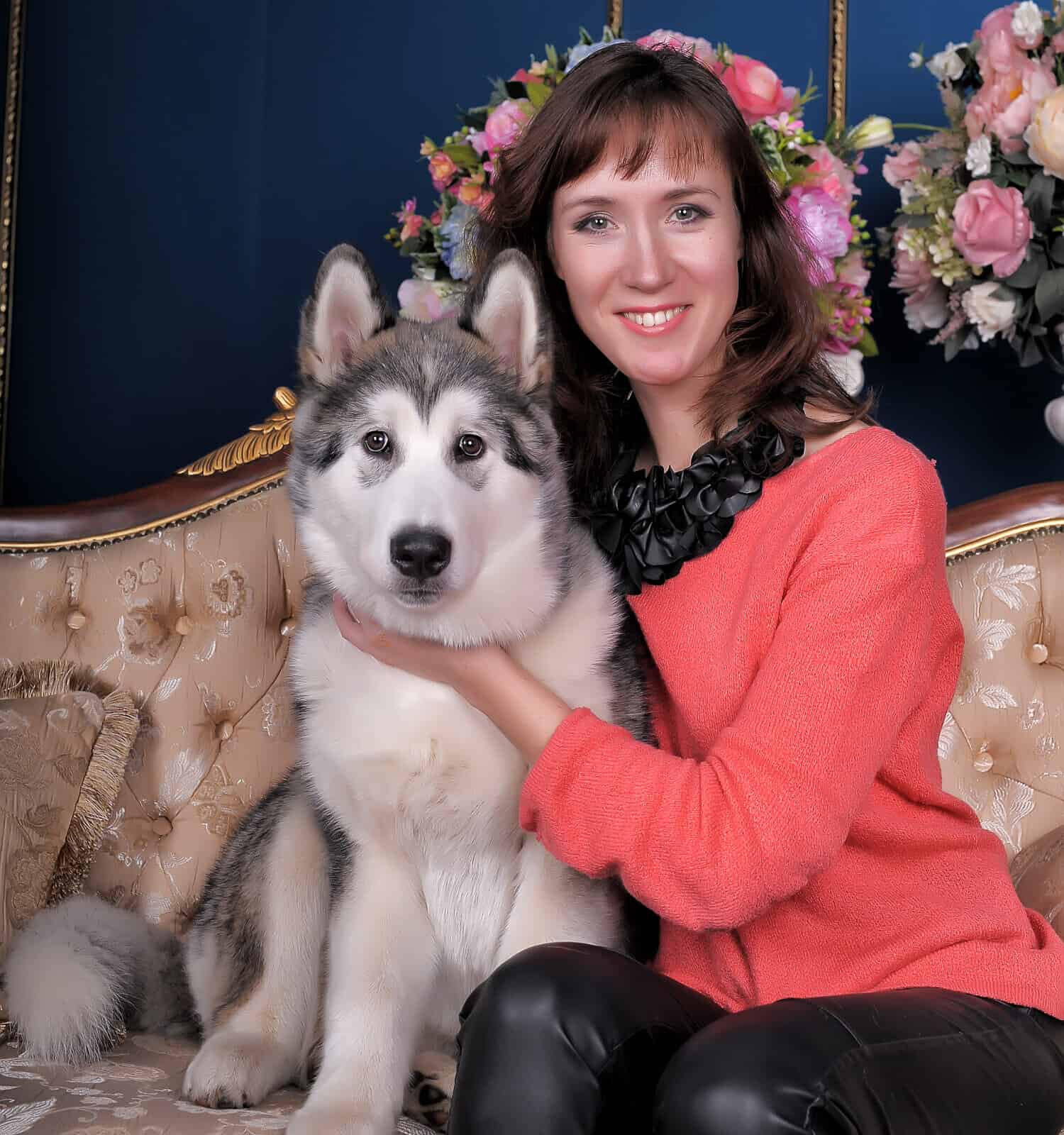 Woman with a puppy Malamute. Happy, adorable.