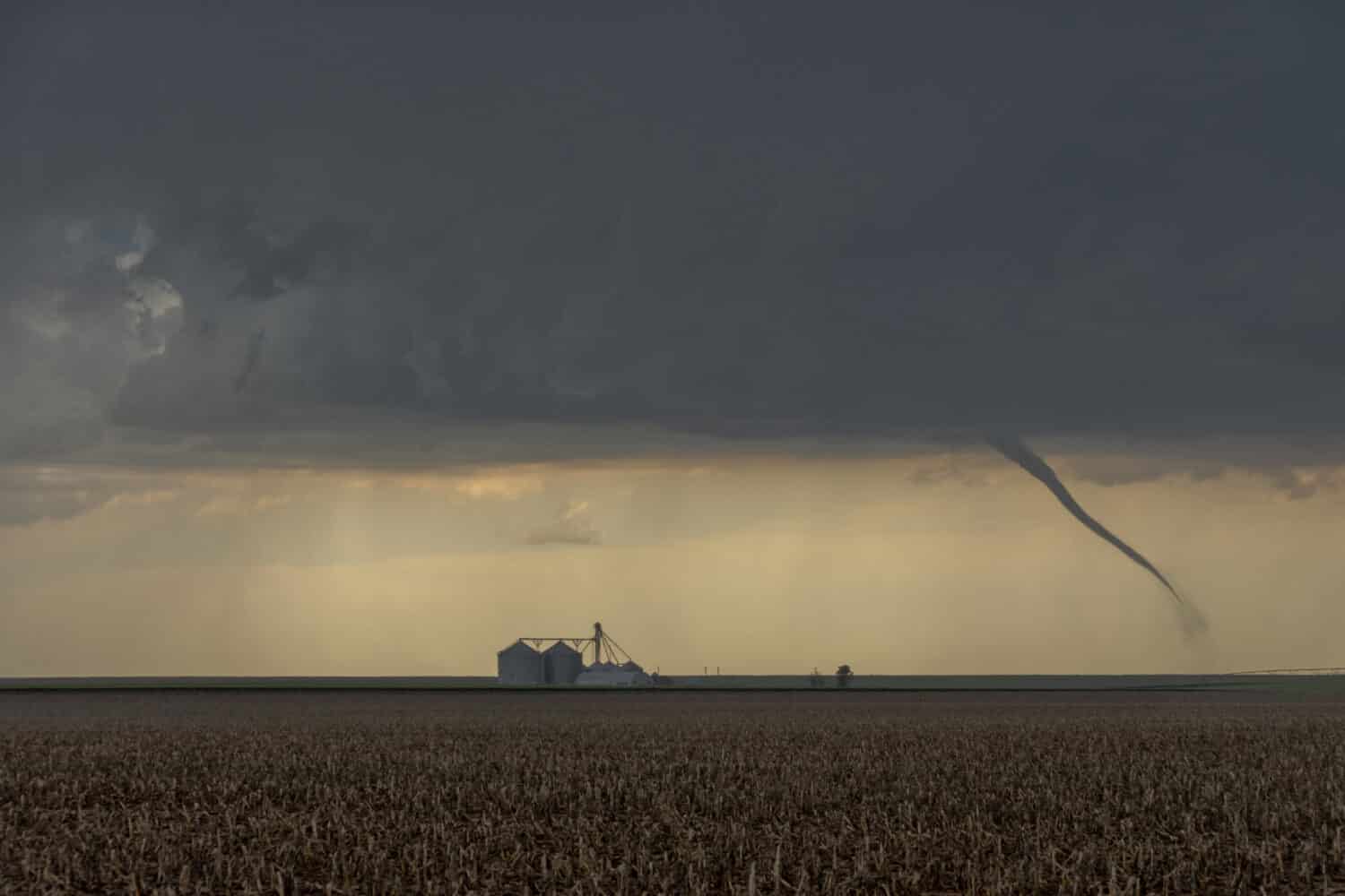 St Francis, Kansas, USA - June 29th, 2019: Tornado next to a silo