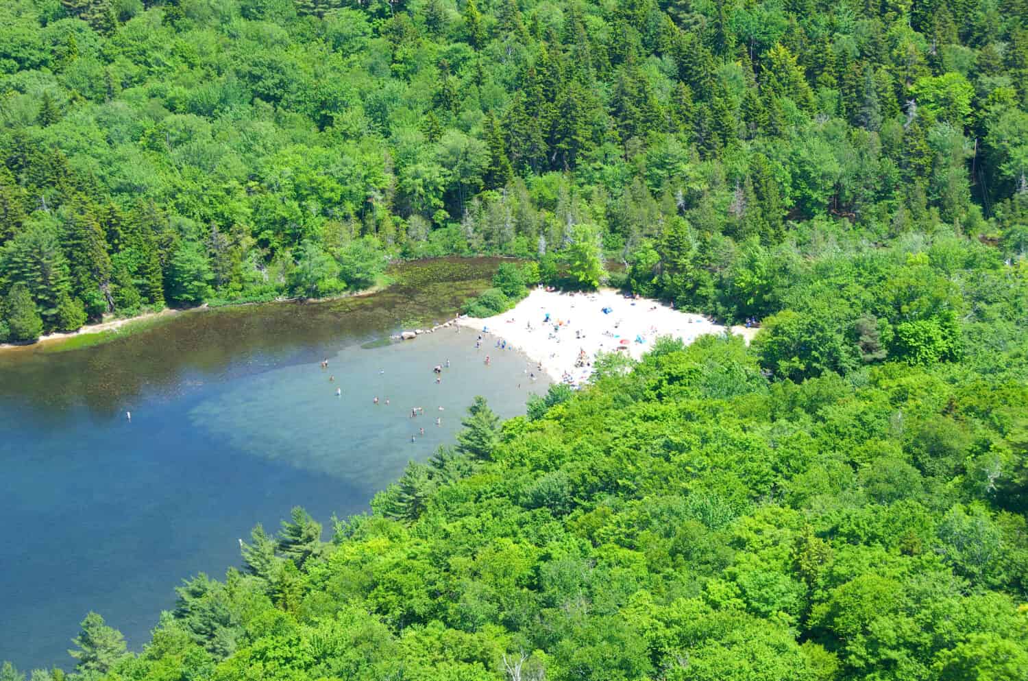 View of Echo Lake Beach from the top of Beech Mountain in the summer in Acadia National Park in Maine. 