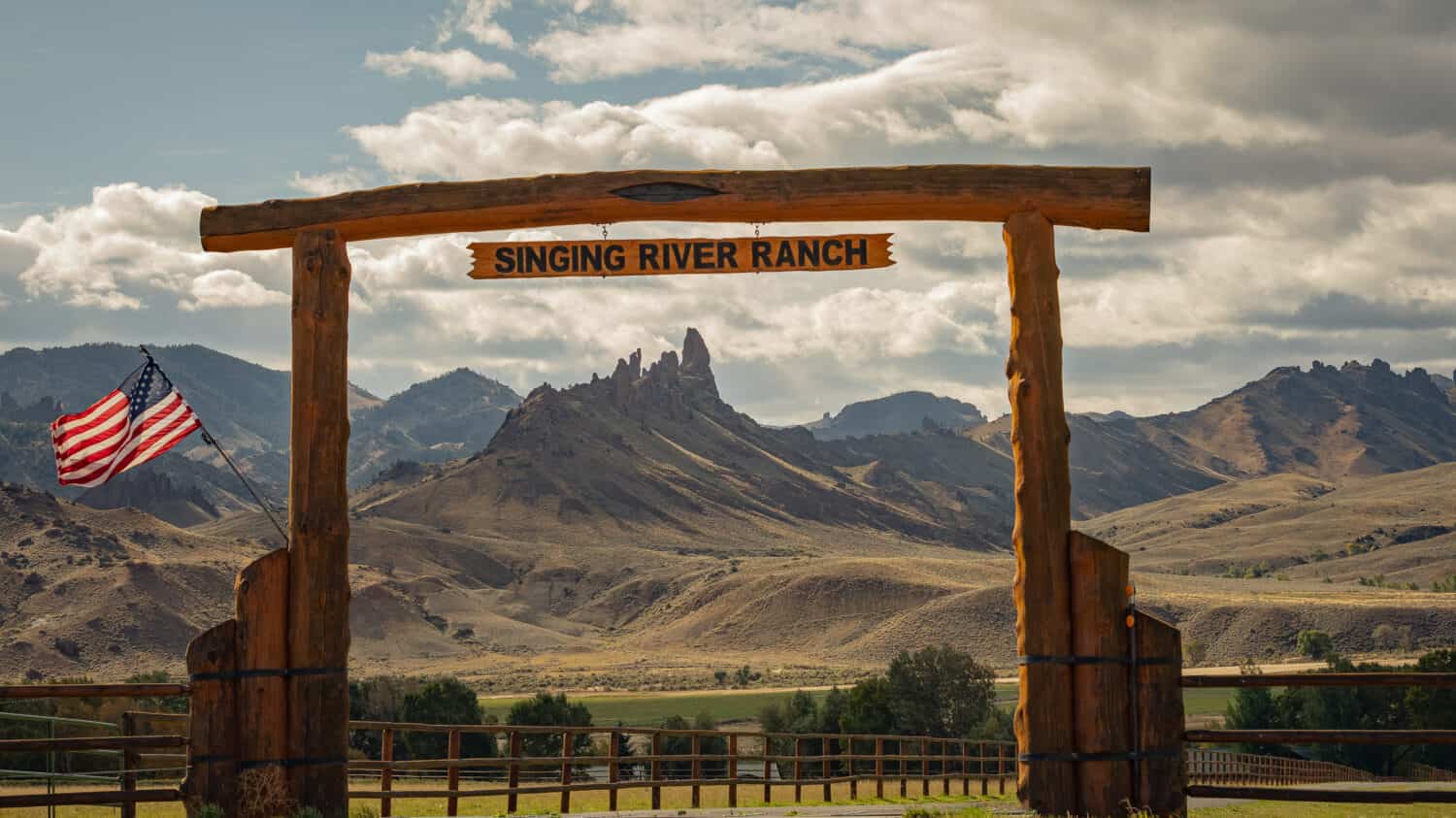 Entrance to a ranch in Cody Wyoming, USA. Beautiful Mountain range in the background.