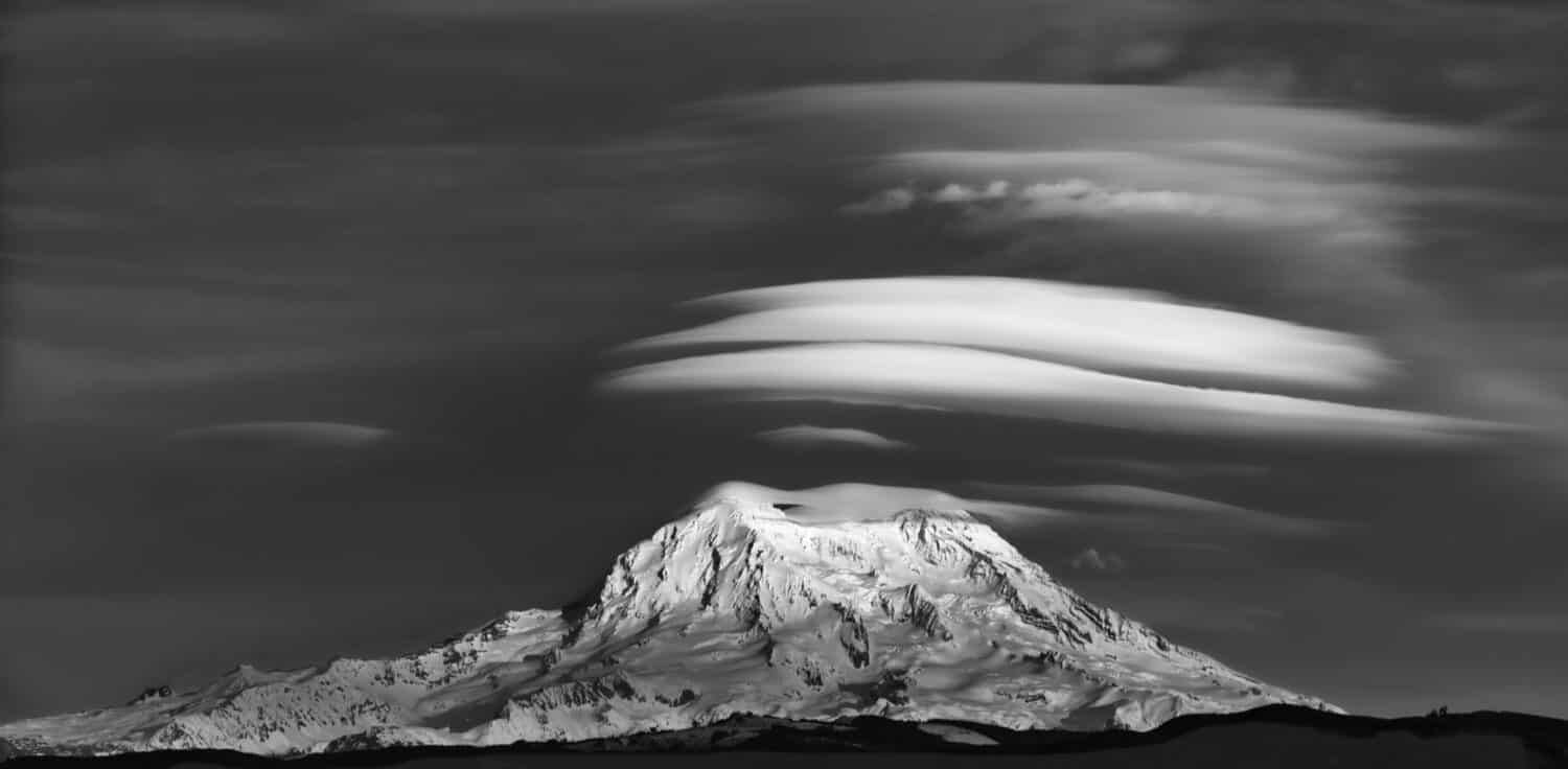 Mount Rainier with lenticular clouds in black and white, Washington, USA