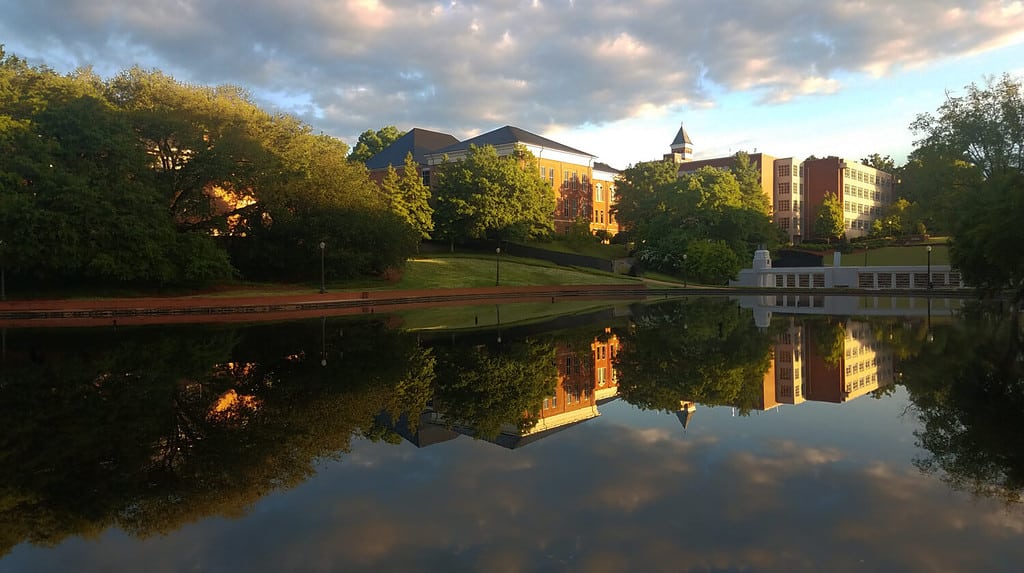 Clemson University building reflection at dawn