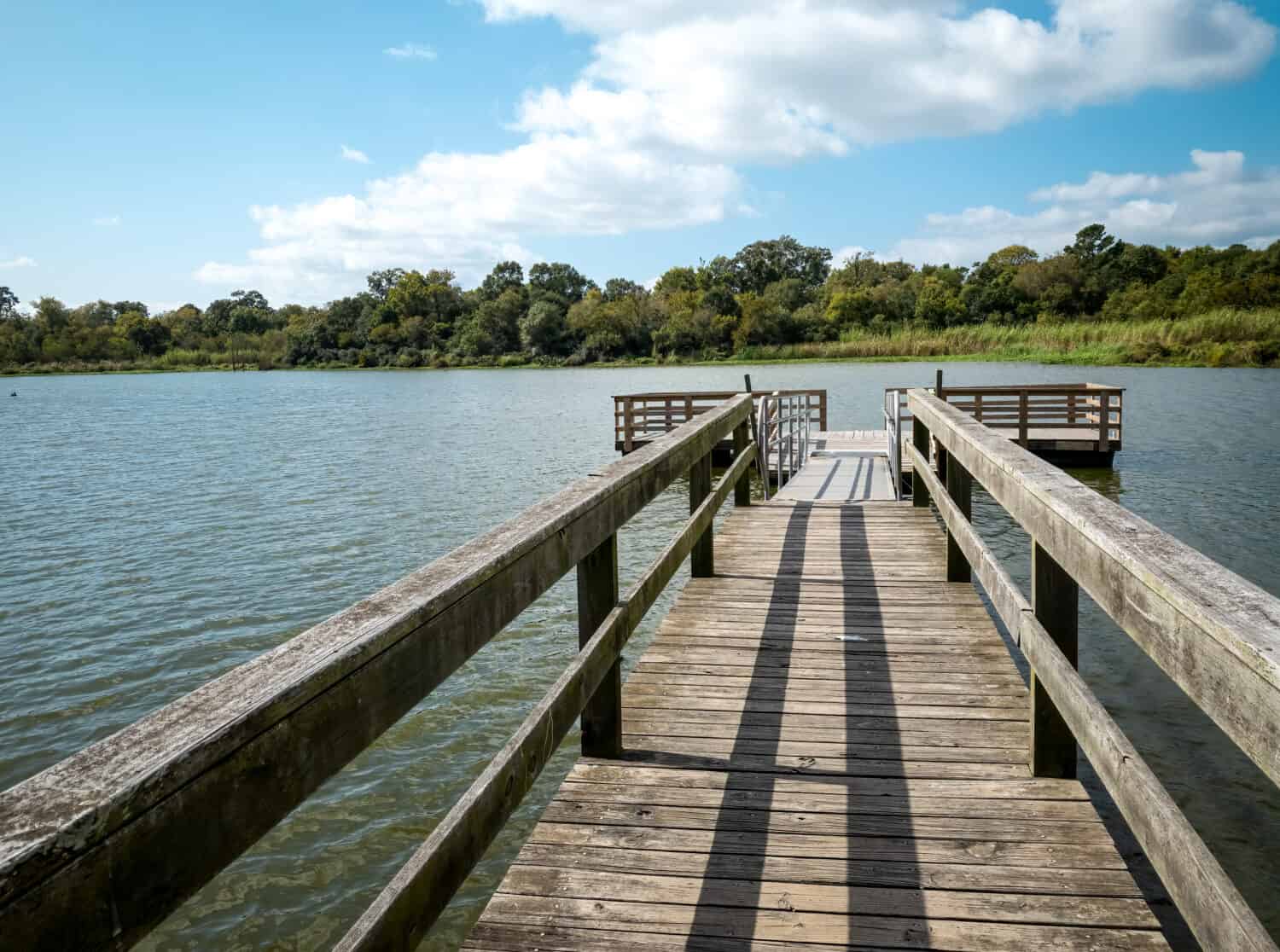 View of Bay Area Park pier and dock on Armand Bayou in Pasadena Texas.