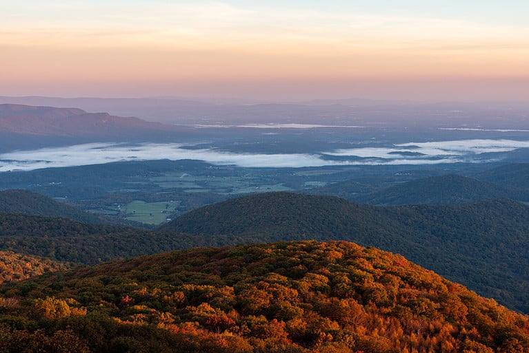 An autumn golden hour photo at Hogback Overlook on Skyline Drive in Shenandoah National Park, Virginia.