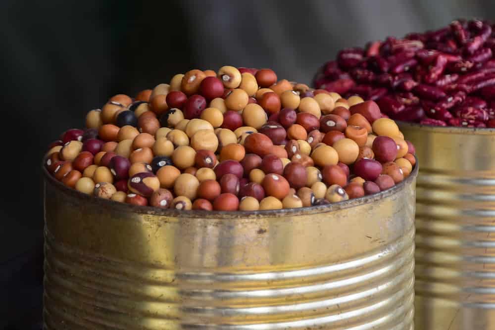 Beans and nuts sold at the local market, bambara groundnuts in a tin can, Manzini market, Swaziland, Eswatini, Africa