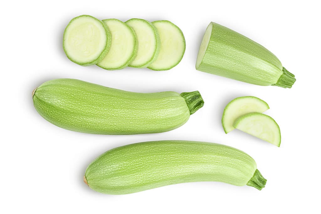 zucchini or marrow isolated on white background with clipping path and full depth of field. Top view. Flat lay
