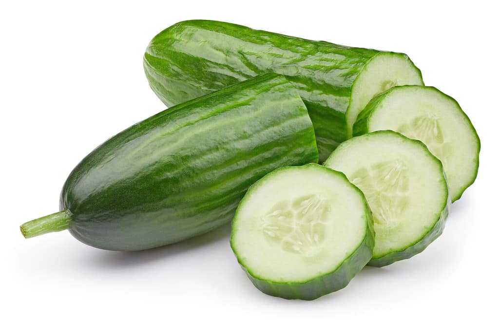 Cucumber clipping path. Cucumber vegetable with cucumber slice isolated on white background. High End Retouching