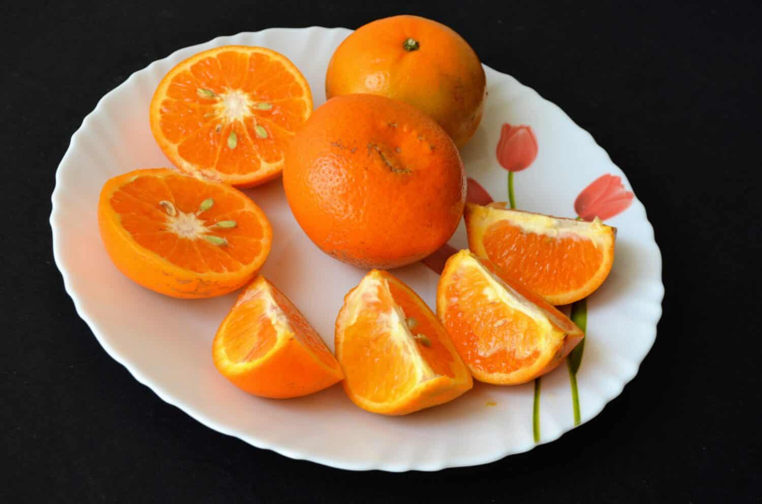 The 'kinnow' is a high yield Mandarin hybrid cultivated extensively in the wider Punjab region of India and Pakistan.Orange coloured Kinnows. Fresh, sweet, tangy, juicy and delicious Kinnows.