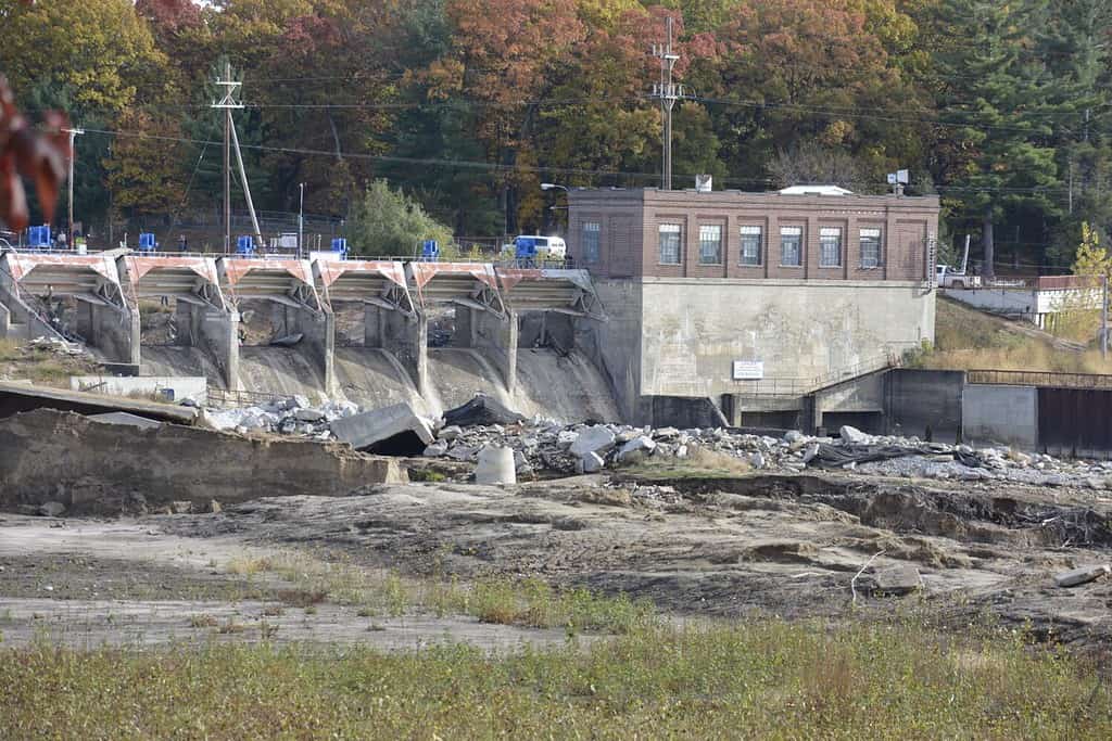Landscape of a dam that has been damaged by flooding and dams breaking and flooding a town