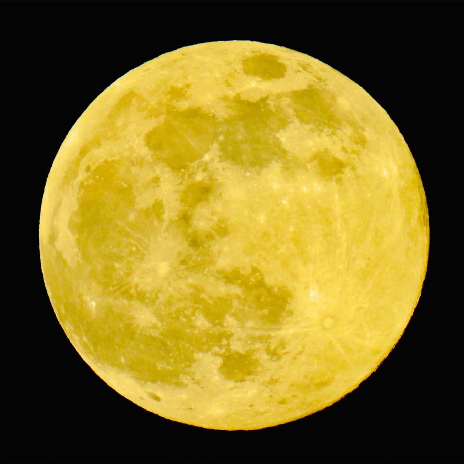 A luminous full yellow moon reigns supreme, casting a celestial glow that bathes the night in an enchanting, ethereal light.