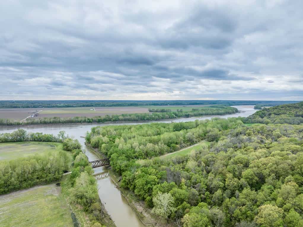Missouri River and Katy Trail crossing Cedar Creek above Jefferson City, MO, cloudy spring aerial view