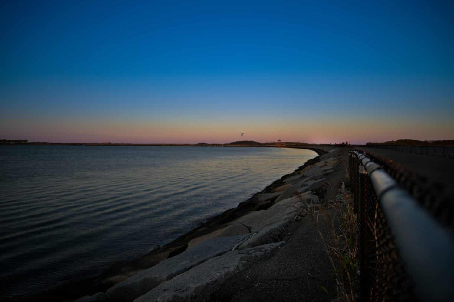 Sunset at Pleasure Bay Flag Pole, Boston, Castle Island. In this images I captured beautiful blue, yellow, pink sunset night. 