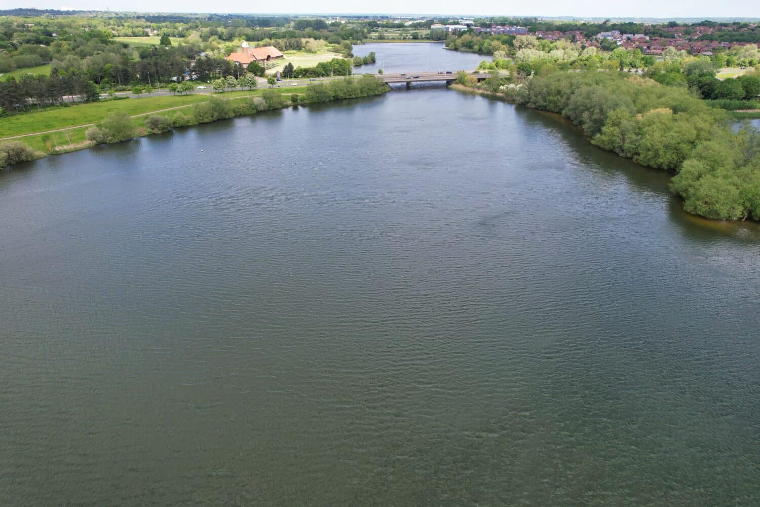 Gorgeous Aerial View of Caldecotte Lake of Milton Keynes City of England Great Britain During Dramatic Clouds over City and Warm Day. The Footage Was Captured on 21-May-2023 with Drone's Camera.