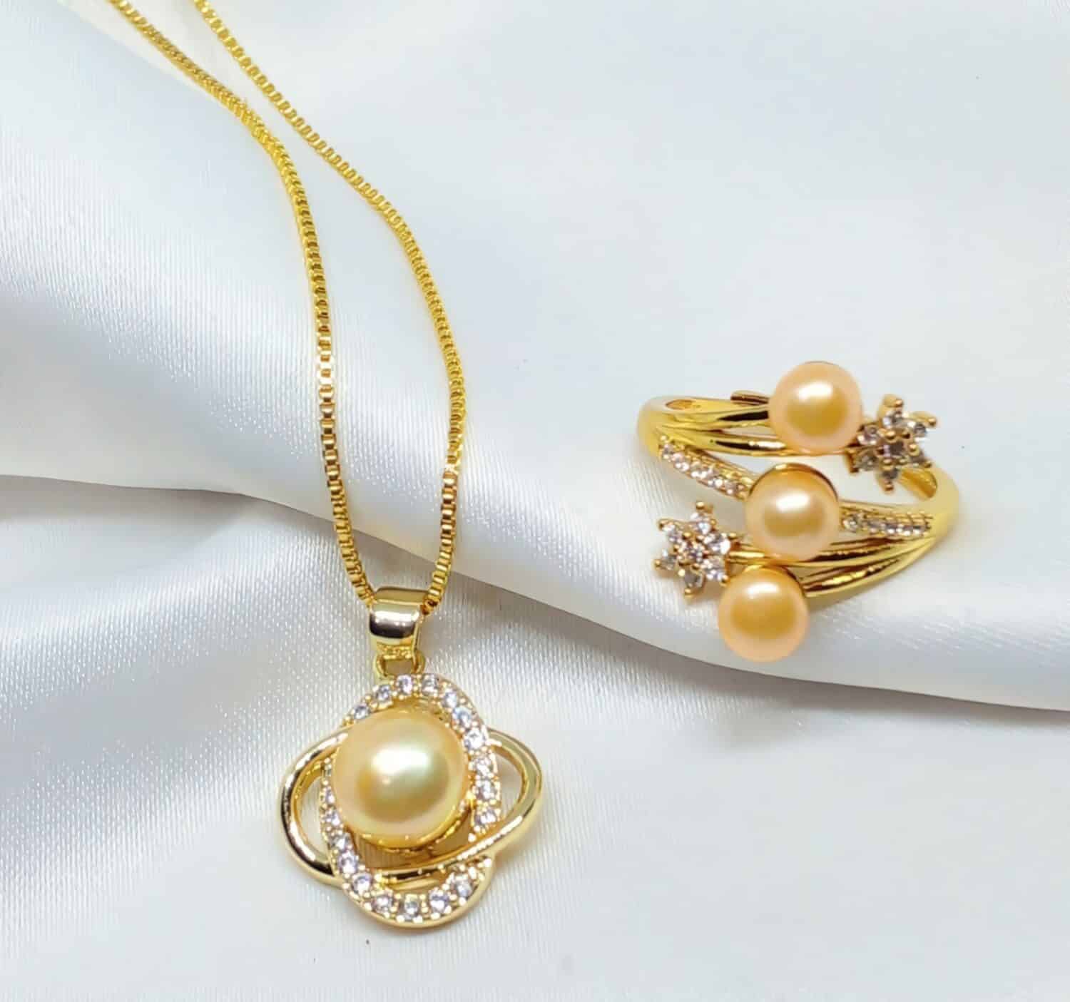 Beauty flowing in every pearl, this golden pearl ring and necklace symbolizes luxury and elegance beyond compare.