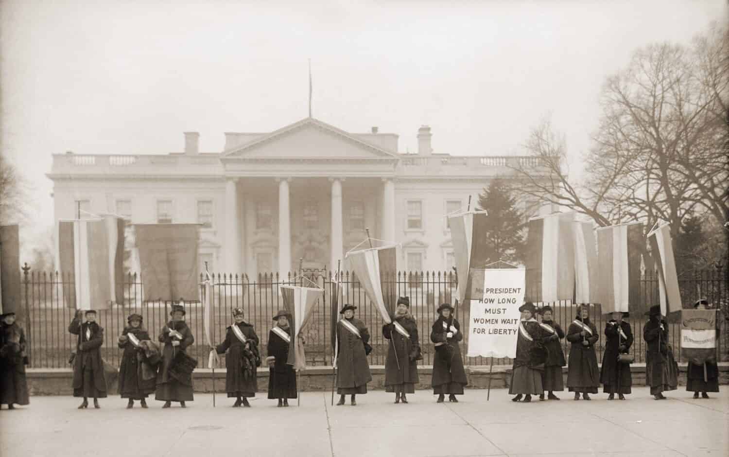 National Women's Party demonstration in front of the White House in 1918. The banner protests Wilson's failure to support women's suffrage.